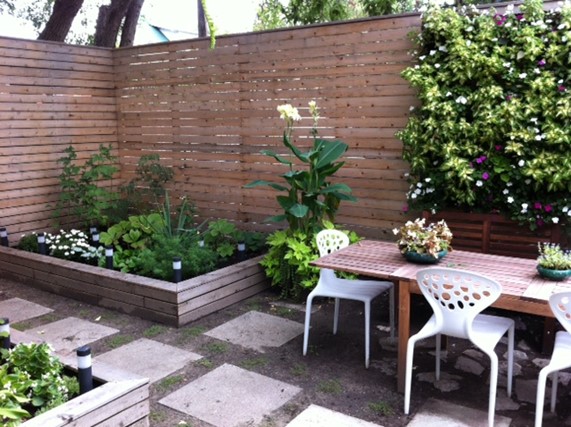 A patio with chairs and tables in the middle of it