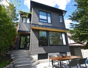 A house with stairs and a table outside